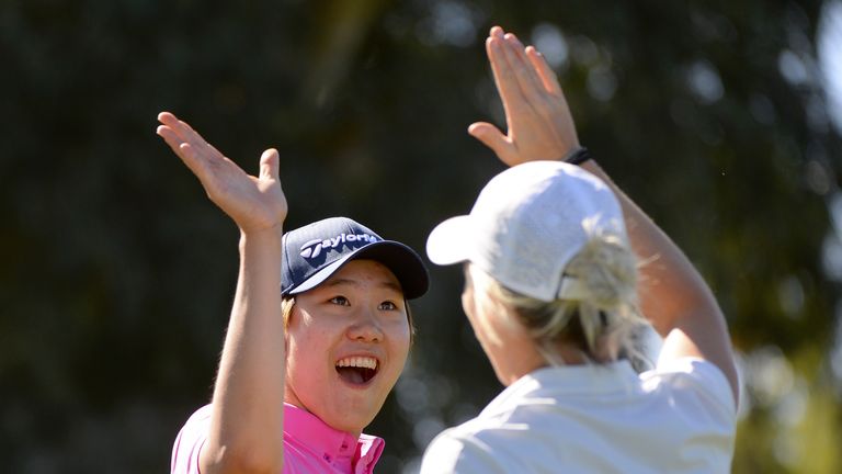 Seong celebrates with playing partner Mel Reid after her hole-in-one at the fifth