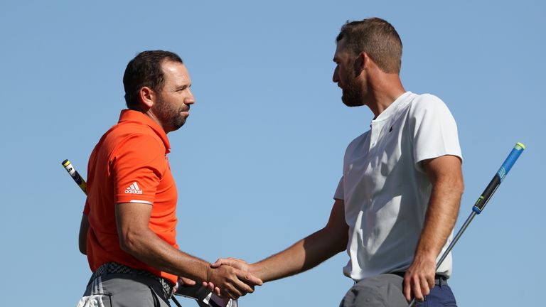 AUSTIN, TX - MARCH 23: Sergio Garcia (L) of Spain shakes hands with Kevin Chappell after winning their match 4&3 during round two of the World Golf Champio