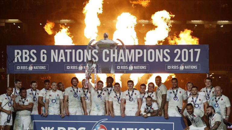 England players celebrate with the trophy after winning the Six Nations Championship on the pitch after the Six Nations international rugby union match bet