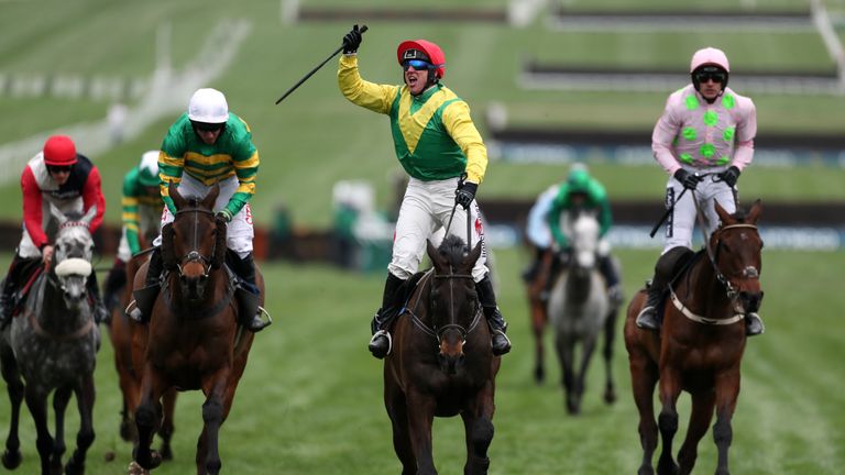 Jockey Robbie Power (centre) celebrates after his winning ride on Sizing John in the Timico Cheltenham Gold Cup Chase during Gold Cup Day of the 2017 Chelt