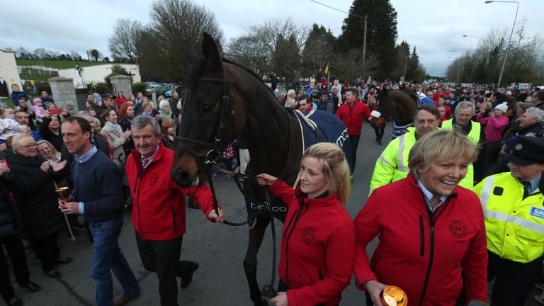 Cheltenham Gold Cup winner Sizing John with jockey Robbie Power (left) and Trainer Jessica Harrington (right) during a parade through Moone Village