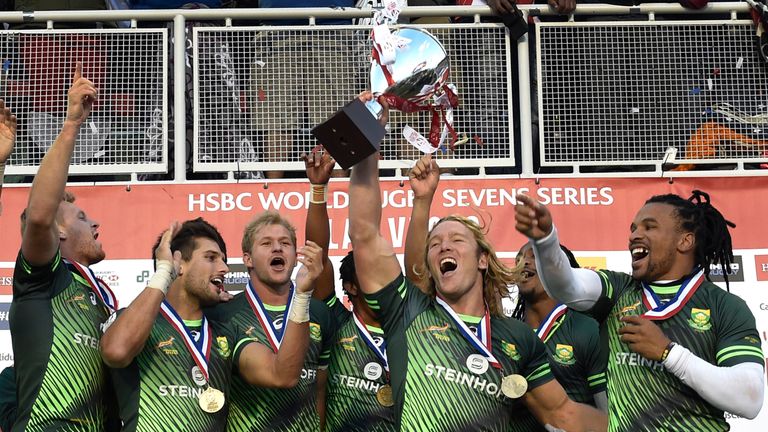 Joeli Lutumailagi (L) of Fiji raises his arms after the Fiji team defeated New Zealand during day three of the USA Sevens Rugby tournament, part of the Wor