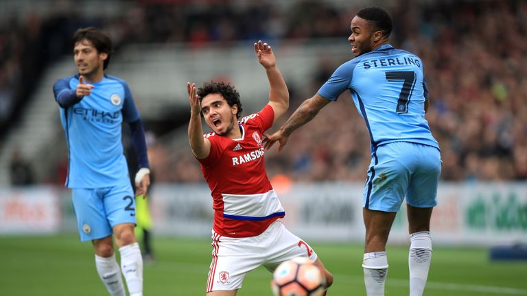 Middlesbrough's Fabio Pereira da Silva (left) and Manchester City's Raheem Sterling (right) battle for the ball during the Emirates FA Cup quarter final at