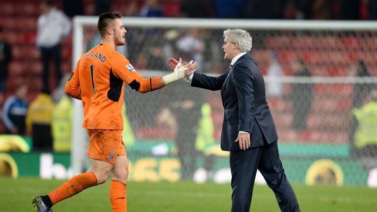 Mark Hughes (R) will not rush Jack Butland (L) back into action