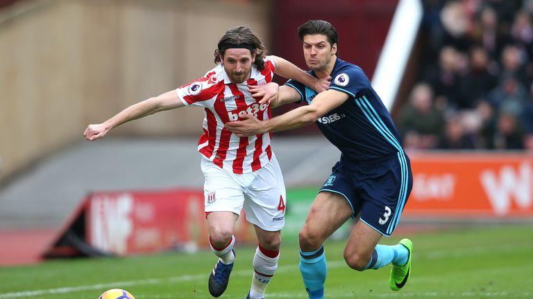 STOKE ON TRENT, ENGLAND - MARCH 04:  Joe Allen of Stoke City (L) and George Friend of Middlesbrough (R) battle for possession during the Premier League