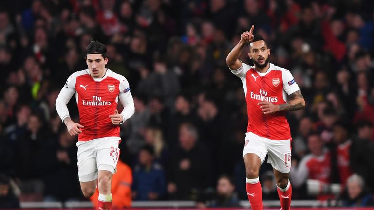 LONDON, ENGLAND - MARCH 07:  Theo Walcott of Arsenal (R) celebrates as he scores their first goal with Hector Bellerin during the UEFA Champions League Rou