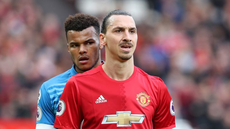 Tyrone Mings keeps a close eye on Zlatan Ibrahimovic during the Premier League match at Old Trafford