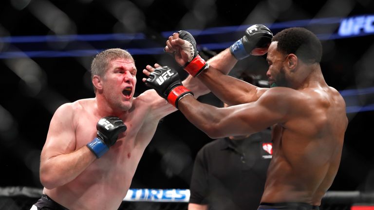 Daniel Kelly (L) of Australia battles with Rashad Evans during their middleweight bout 