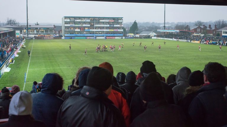 Wakefield Trinity v Hull FC - Belle Vue Stadium, Wakefield, England - Fans and supporters watch from the stands as rain pours down.