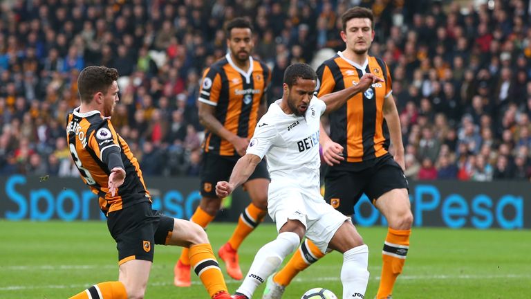 Wayne Routledge of Swansea City (C) shoots during the Premier League match between Hull City and Swansea City
