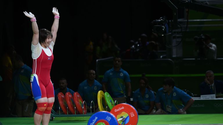 North Korea's Rim Jong Sim celebrates after winning the gold medal during the women's weightlifting 75kg event during the Rio 2016 Olympics Games in Rio de