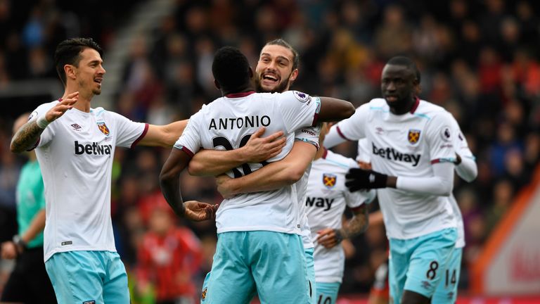 Michail Antonio of West Ham United (C) celebrates scoring his side's first goal with Andy Carroll of West Ham United