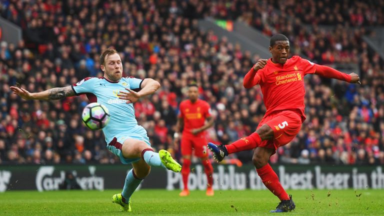 LIVERPOOL, ENGLAND - MARCH 12:  Georginio Wijnaldum of Liverpool shoots past Scott Arfield of Burnley during the Premier League match between Liverpool and