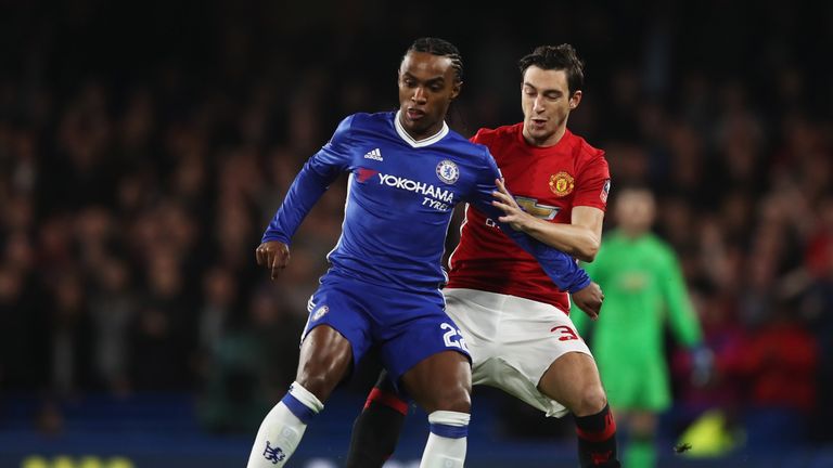 LONDON, ENGLAND - MARCH 13:  Willian of Chelsea holds off Matteo Darmian of Manchester United during The Emirates FA Cup Quarter-Final match between Chelse