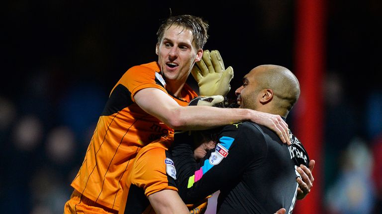 BRENTFORD, ENGLAND - MARCH 14: David Edwards, Danny Batth and Carl Ikeme of Wolves celebrate on the final whistle after the Sky Bet Championship match betw