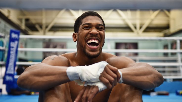 SHEFFIELD, ENGLAND - APRIL 19:  Anthony Joshua takes a break during the media workout at EIS Sheffield on April 19, 2017