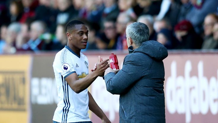 Jose Mourinho shakes hands with Anthony Martial as he is substituted against Burnley