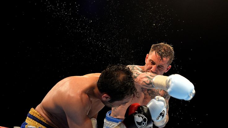 Ricky Burns and Michele Di Rocco in action during the WBA world super-lightweight title fight
