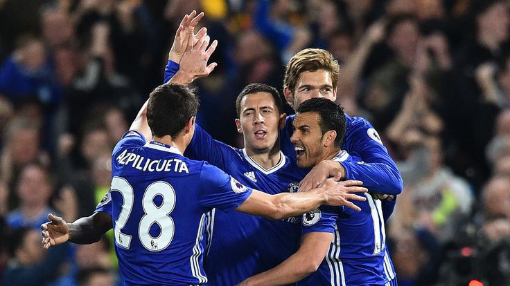 Eden Hazard is mobbed by team-mates after scoring Chelsea's first goal against Manchester City