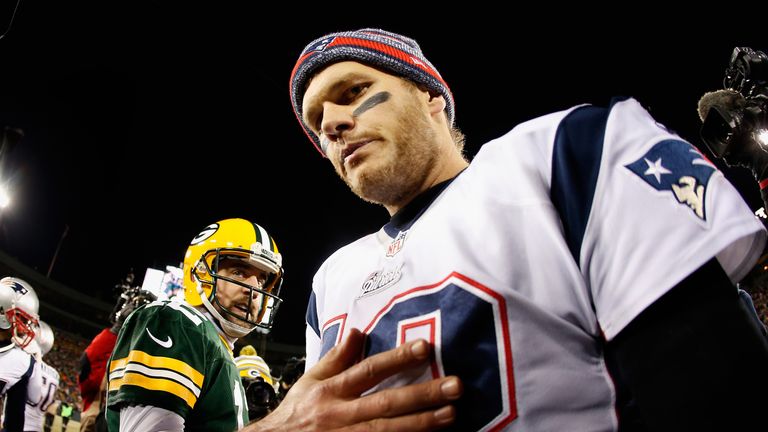 GREEN BAY, WI - NOVEMBER 30:  Quarterback Tom Brady #12 of the New England Patriots walks away from Aaron Rodgers #12 of the Green Bay Packers after shakin