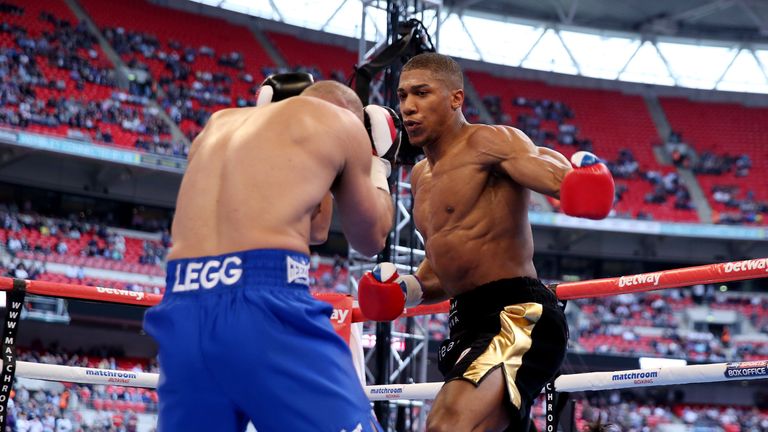 Anthony Joshua in action with Matt Legg during their Heavyweight bout at Wembley Stadium on May 31, 2014 