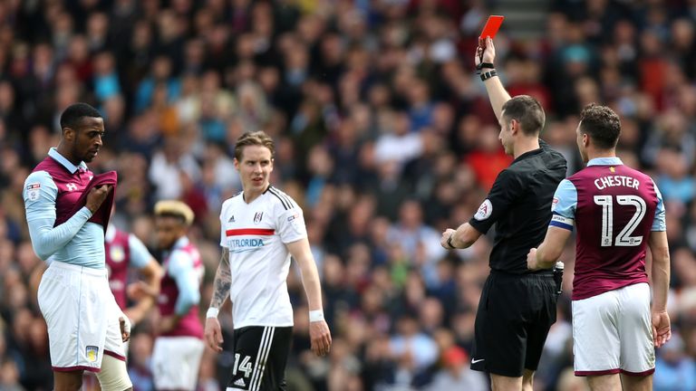 LONDON, ENGLAND - APRIL 17: Jonathan Kodija of Aston Villa is shown a red card during the Sky Bet Championship match between Fulham and Aston Villa at Crav