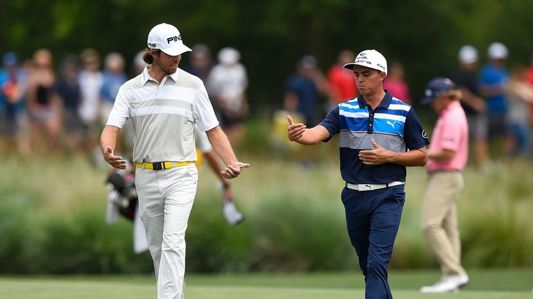 HUMBLE, TX - APRIL 01:  (L-R) Aaron Baddeley of Australia and Rickie Fowler walk down the second fairway during round three of the Shell Houston Open at th