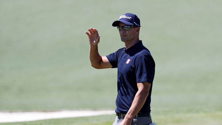 Adam Scott of Australia waves after making a birdie on the second hole during the third round of the 2017 Masters Tournament at Au