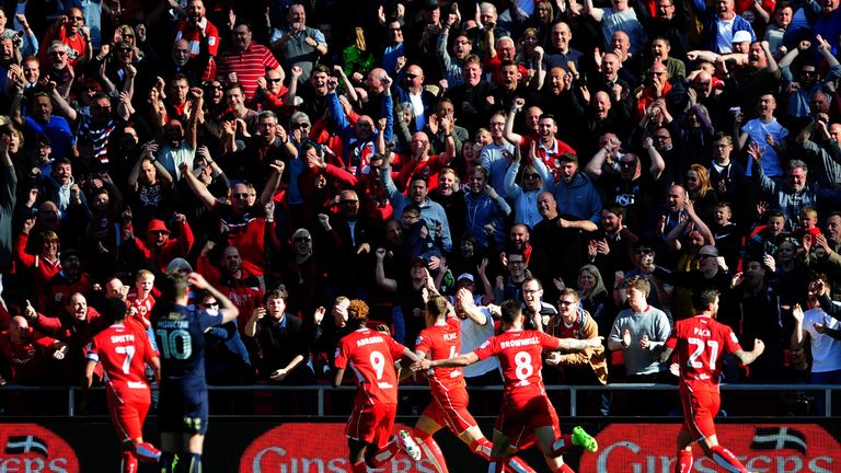 Aden Flint of Bristol City celebrates his side's third goal 