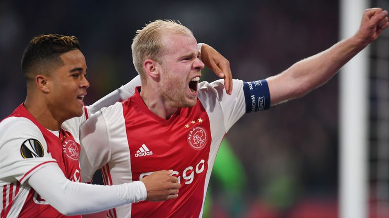 Ajax Amsterdam's midfielder Davy Klaassen (R) celebrates with teammate Ajax Amsterdam's Dutch striker Justin Kluivert after scoring during the UEFA Europa 