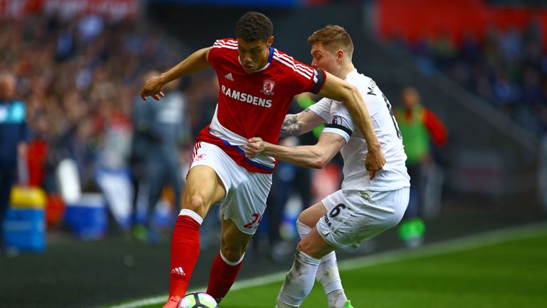 Rudy Gestede vies with Swansea's Alfie Mawson