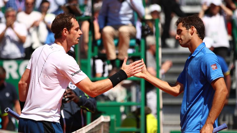 Andy Murray of Great Britain (L) and Albert Ramos-Vinolas of Spain shake hands following their third round match