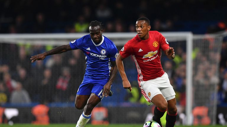 Manchester United's French striker Anthony Martial (R) takes on Chelsea's Nigerian midfielder Victor Moses (L) during the English Premier League football 