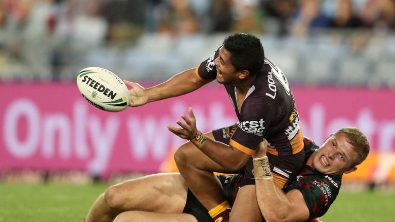 SYDNEY, AUSTRALIA - APRIL 21:  Anthony Milford of the Broncos passes as he is tackled by George Burgess of the Rabbitohs during the round eight NRL match b