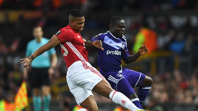  Frank Acheampong of RSC Anderlecht is tackled by Antonio Valencia of Manchester United during the UEFA Europa League quarter final