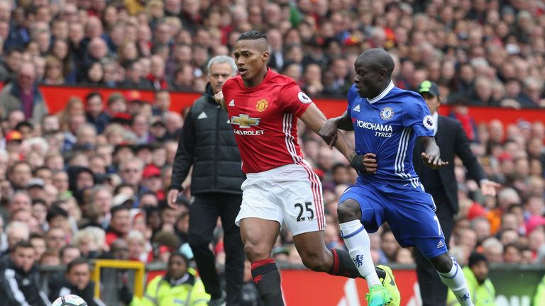 Antonio Valencia and N'Golo Kante during the Premier League match between Manchester United and Chelsea at Old Trafford
