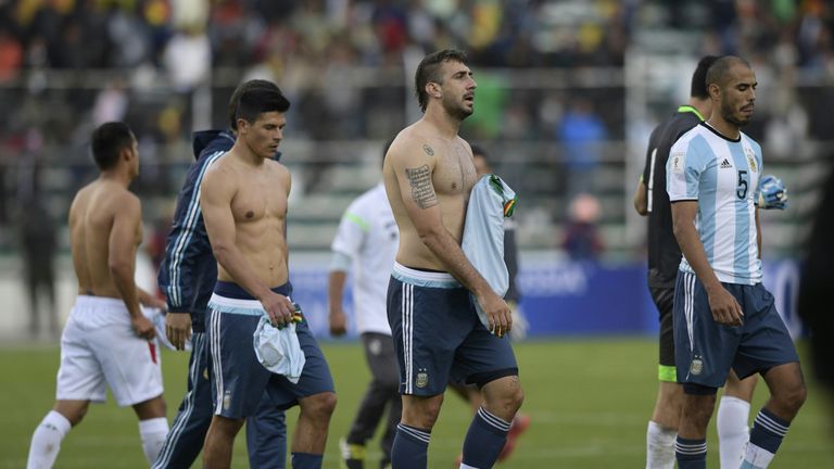 (L-R) Argentina's Facundo Roncaglia, Lucas Pratto and Guido Pizarro leave the field after losing v Bolivia in World Cup qualifying