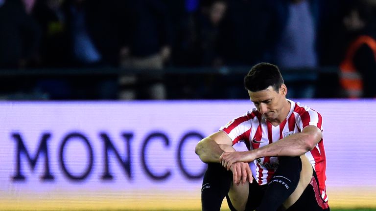 Athletic Bilbao's forward Aritz Aduriz sits on the ground after the Spanish league football match Villarreal CF vs Athletic Club Bilbao at El Madrigal stad