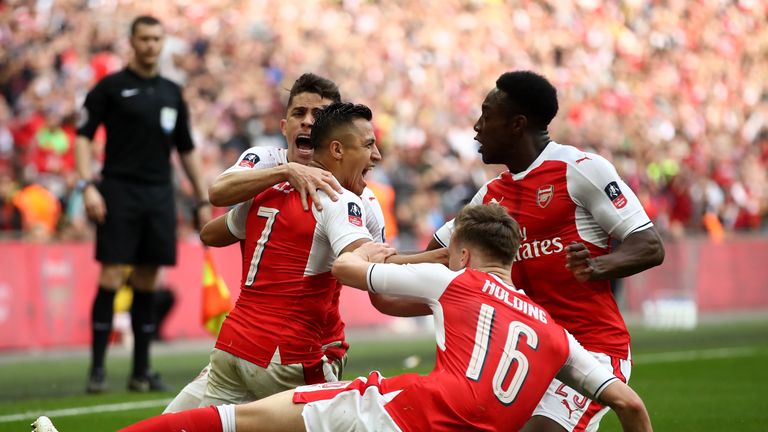 Alexis Sanchez celebrates scoring Arsenal's second of the game in extra-time