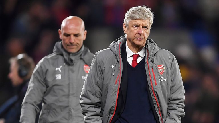 Arsene Wenger walks away dejected after the 3-0 defeat to Crystal Palace at Selhurst Park