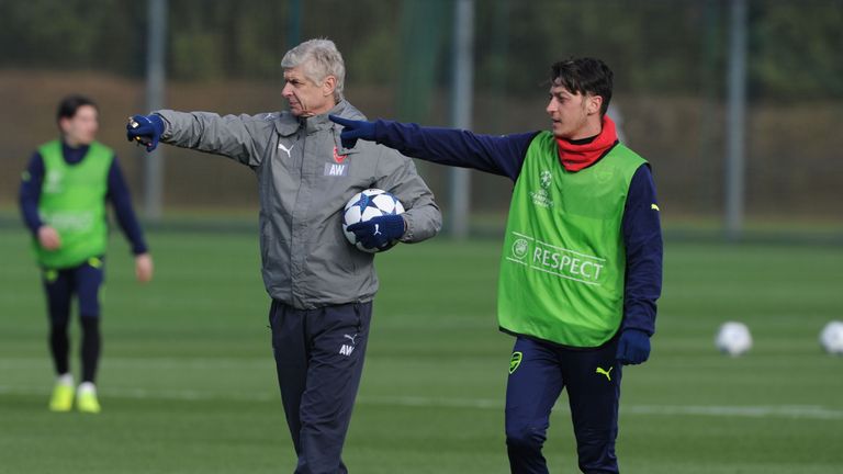 Arsene Wenger and Mesut Ozil in training at London Colney