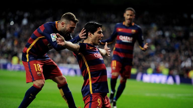 MADRID, SPAIN - NOVEMBER 21:  Luis Suarez of FC Barcelona celebrates with Jordi Alba after scoring his team's 4th goal during the La Liga match between Rea