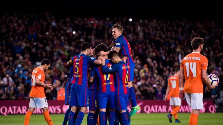 BARCELONA, SPAIN - APRIL 26:  Players of FC Barcelona celebrate with their teammate Javier Mascherano after he scored their team's sixth goal during the La