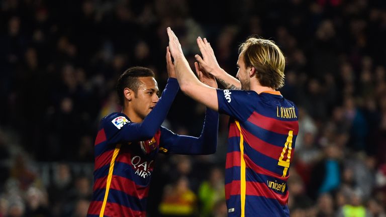 BARCELONA, SPAIN - JANUARY 17:  Ivan Rakitic of FC Barcelona celebrates with his teammate after scoring his team's fourth goal during the La Liga match bet