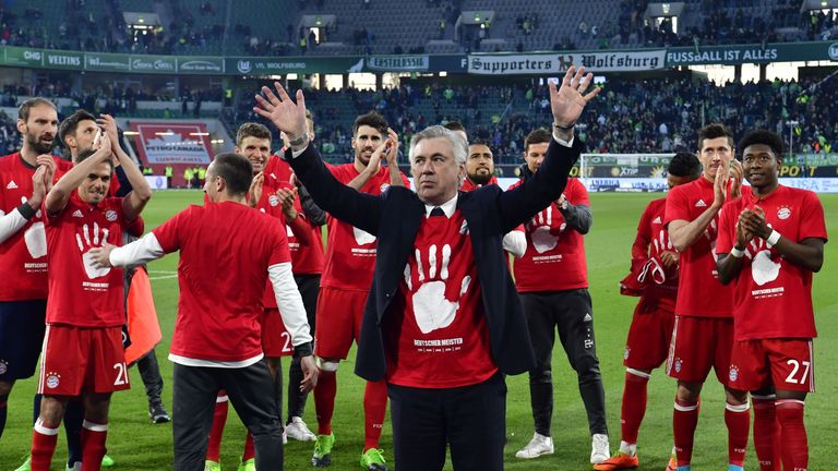 Bayern's team celebrates becoming the new German champion after the German first division Bundesliga football match between VfL Wolfsburg and Bayern Munich