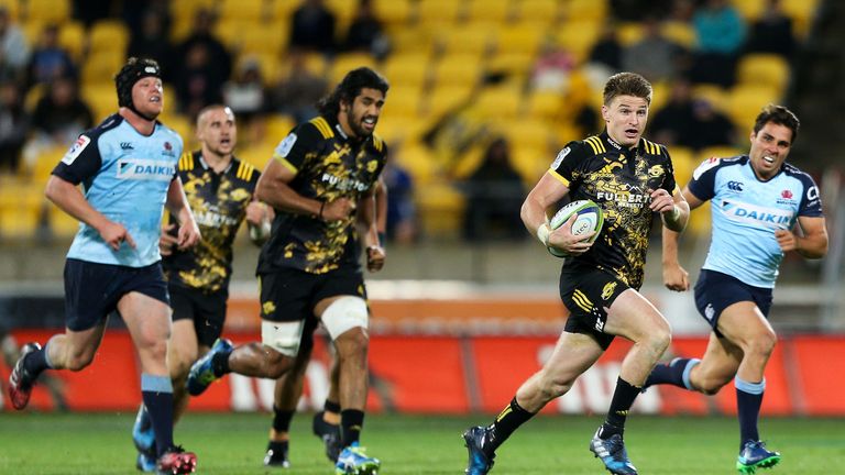 Beauden Barrett of the Hurricanes makes a break during the Super Rugby round seven match