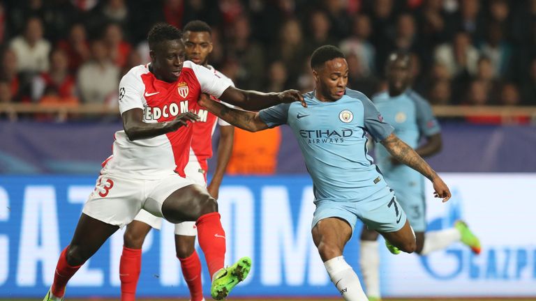 Monaco's French defender Benjamin Mendy (L) challenges Manchester City's English midfielder Raheem Sterling during the UEFA Champions League round of 16