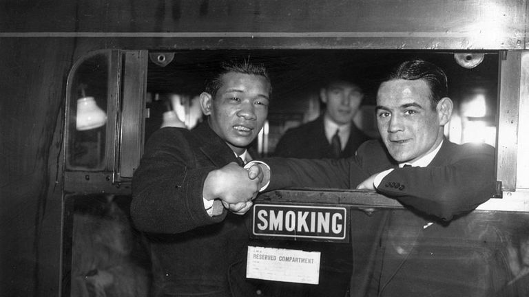 1937 World flyweight champion Benny Lynch (r) bidding goodbye to Filipino boxer Small Montana after the Scot won points