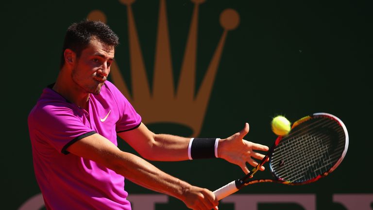 Bernard Tomic is through to face Andy Murray at the Barcelona Open after beating Dustin Brown