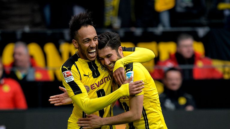 Dortmund's Gabonese forward Pierre-Emerick Aubameyang (L) celebrates his 3-1 goal during the German First division Bundesliga football match between Boruss